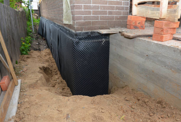 SJ Waterproofing Pros technician performing targeted Wet Basement Repair assessment in Jeffersonton, VA